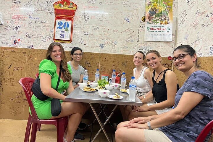 Hue: Night Street Food Tour by E Bike with a Lady Rider