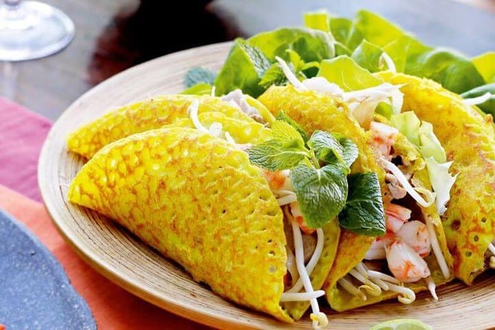 Hue: Night Street Food Tour by E Bike with a Lady Rider