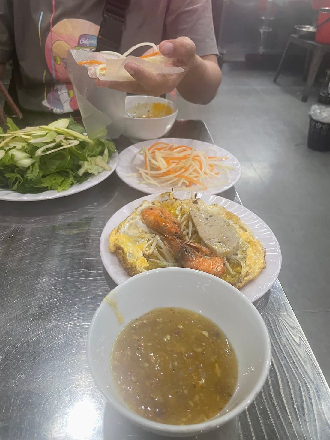 Hue: Night Street Food Tour by E Bike with a Lady Rider