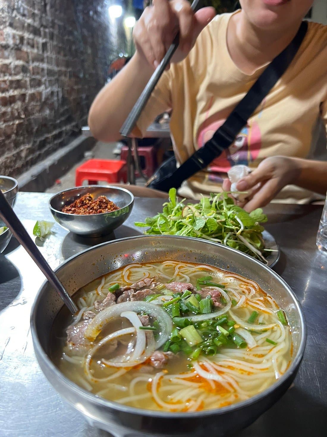 Hue: Night Street Food Tour by E Bike with a Lady Rider