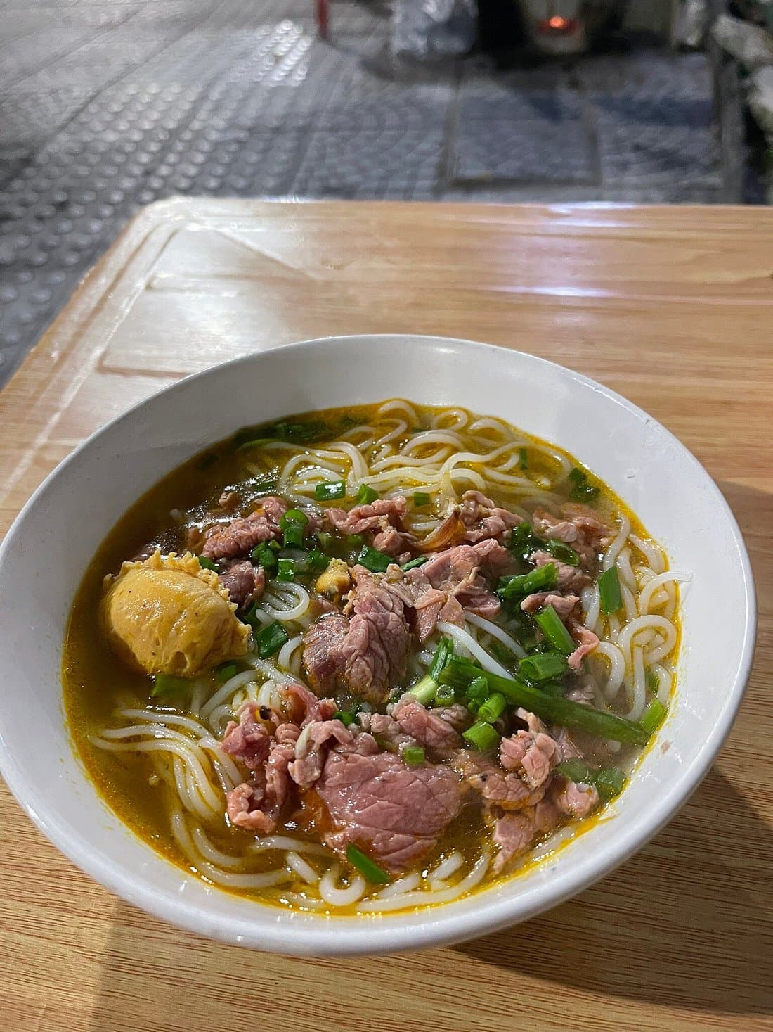 Hue: Night Street Food Tour by E Bike with a Lady Rider